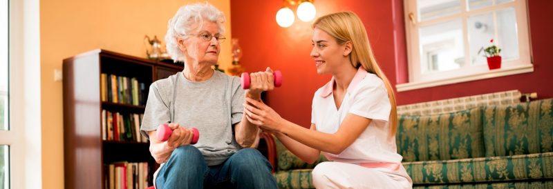 senior care: helping a senior to exercise